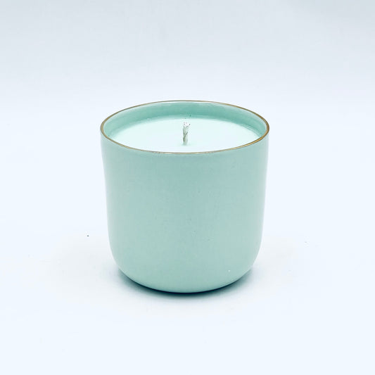 Soy wax candle in a handmade porcelain container, with Bergamot, Melissa and Jasmine fragrance notes