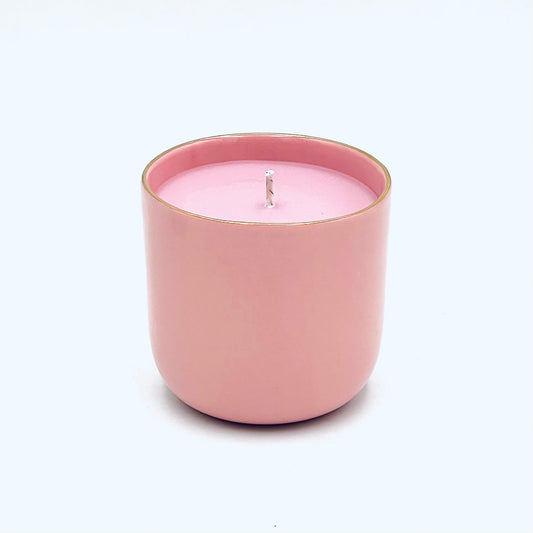 Soy wax candle in a handmade porcelain container, with notes of Magnolia, Rosewood and Sandalwood aromas